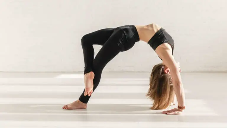 straighten arms in wheel pose
