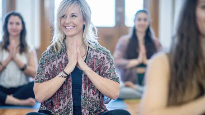 Meditation teacher is leading guided meditation class